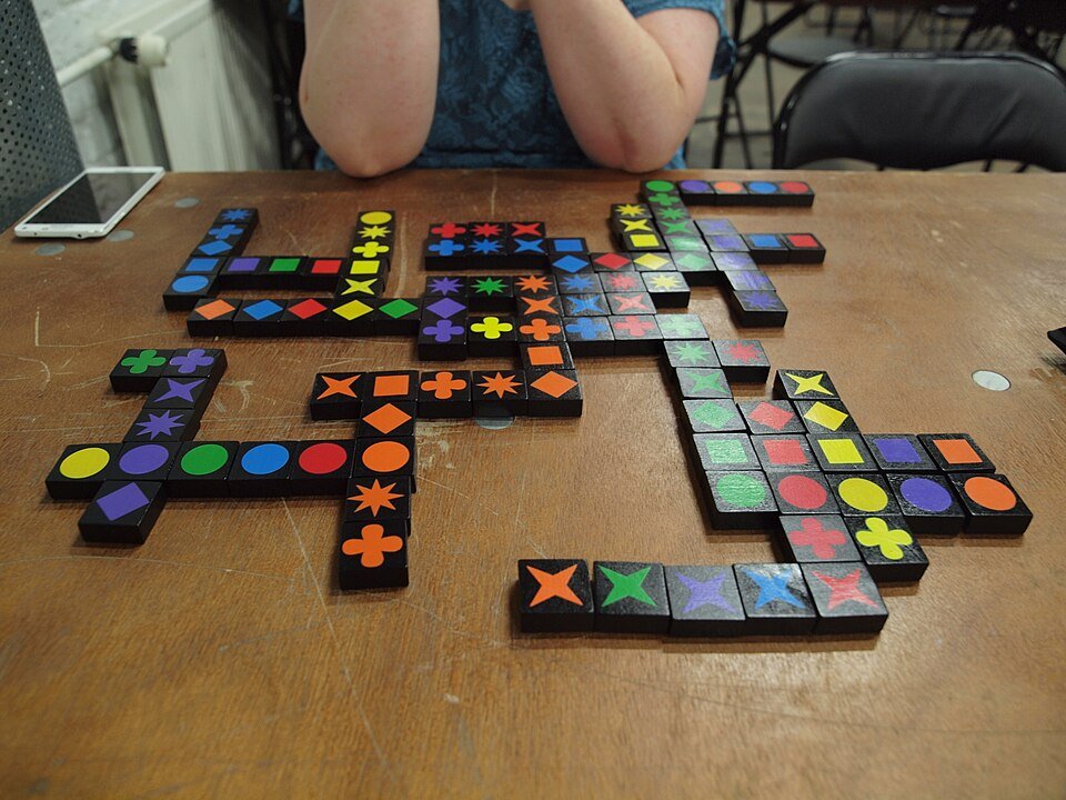 Qwirkle board game in play with game pieces