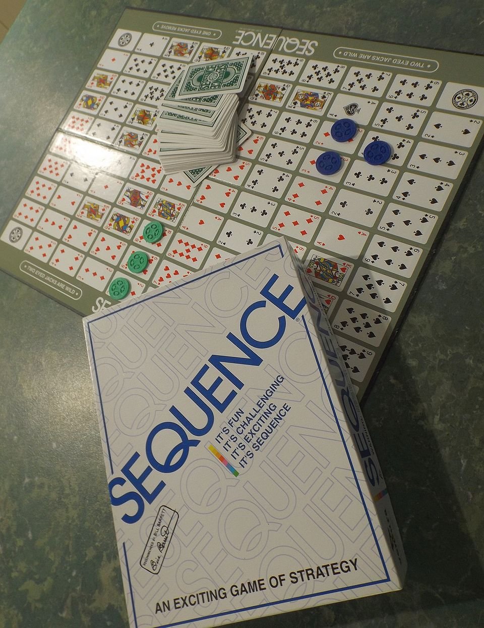 sequence box with game board cards and chips