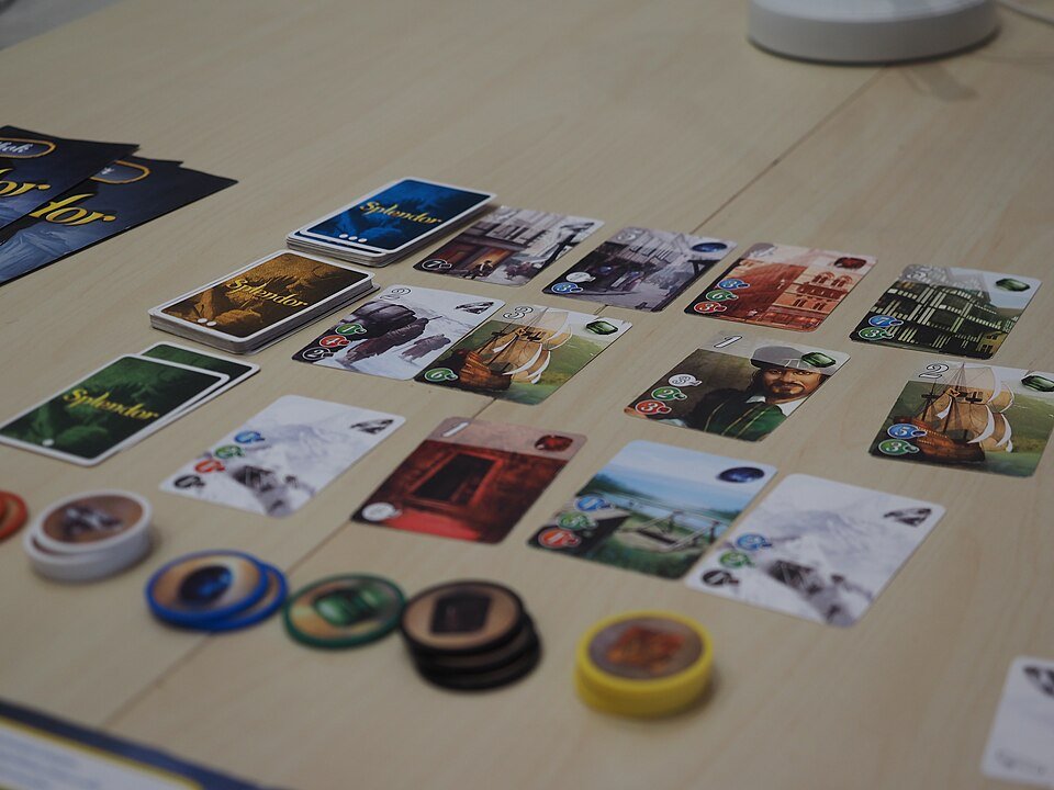 Splendor gem chips and cards in a row
