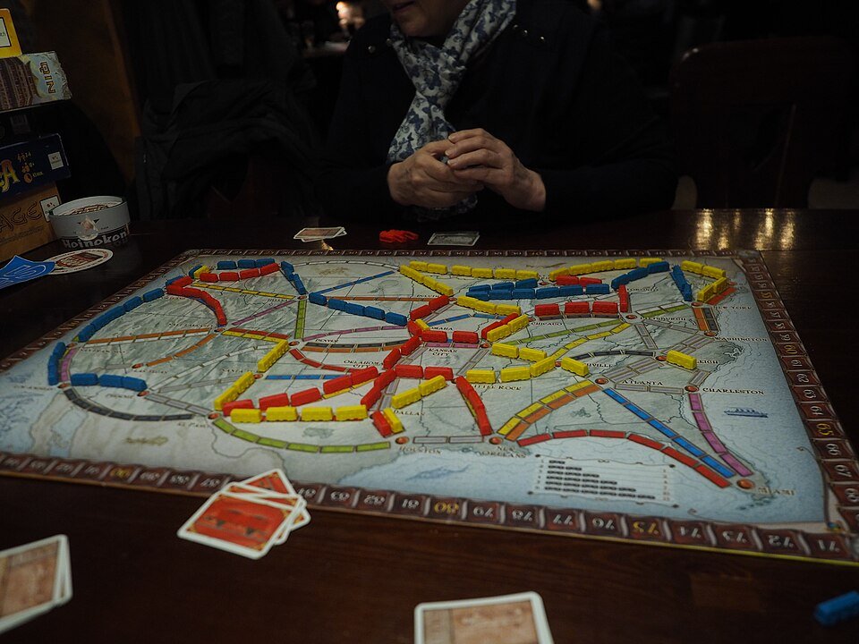 Ticket to Ride game with pieces and cards