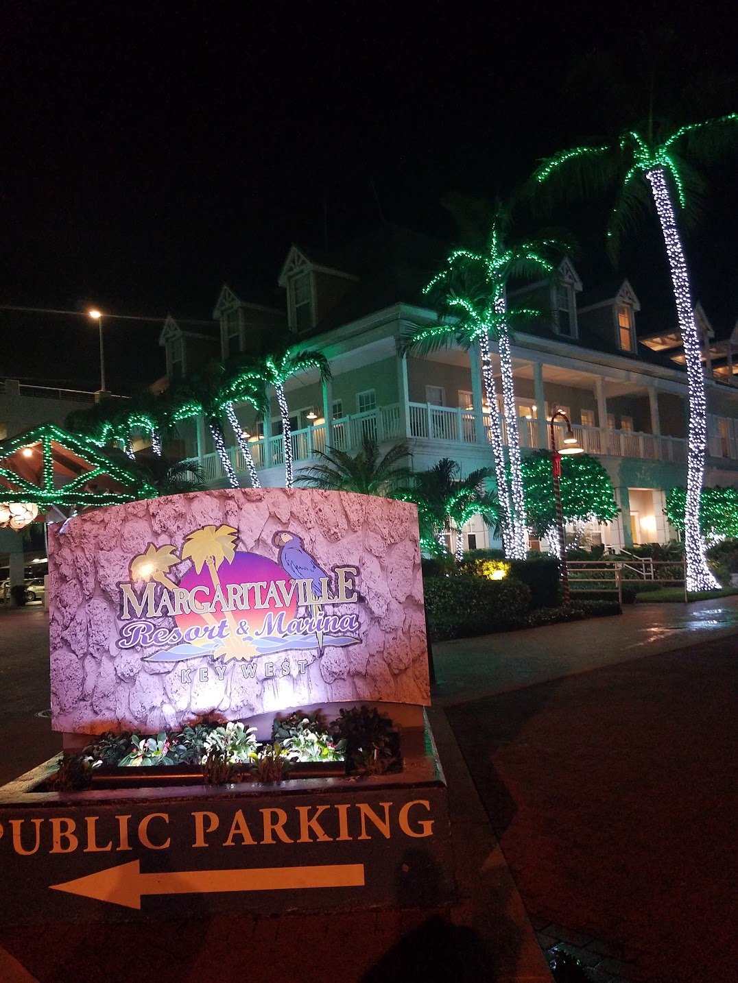 Margaritaville Resort Key West with palm trees wrapped in Christmas lights at night during Florida vacation