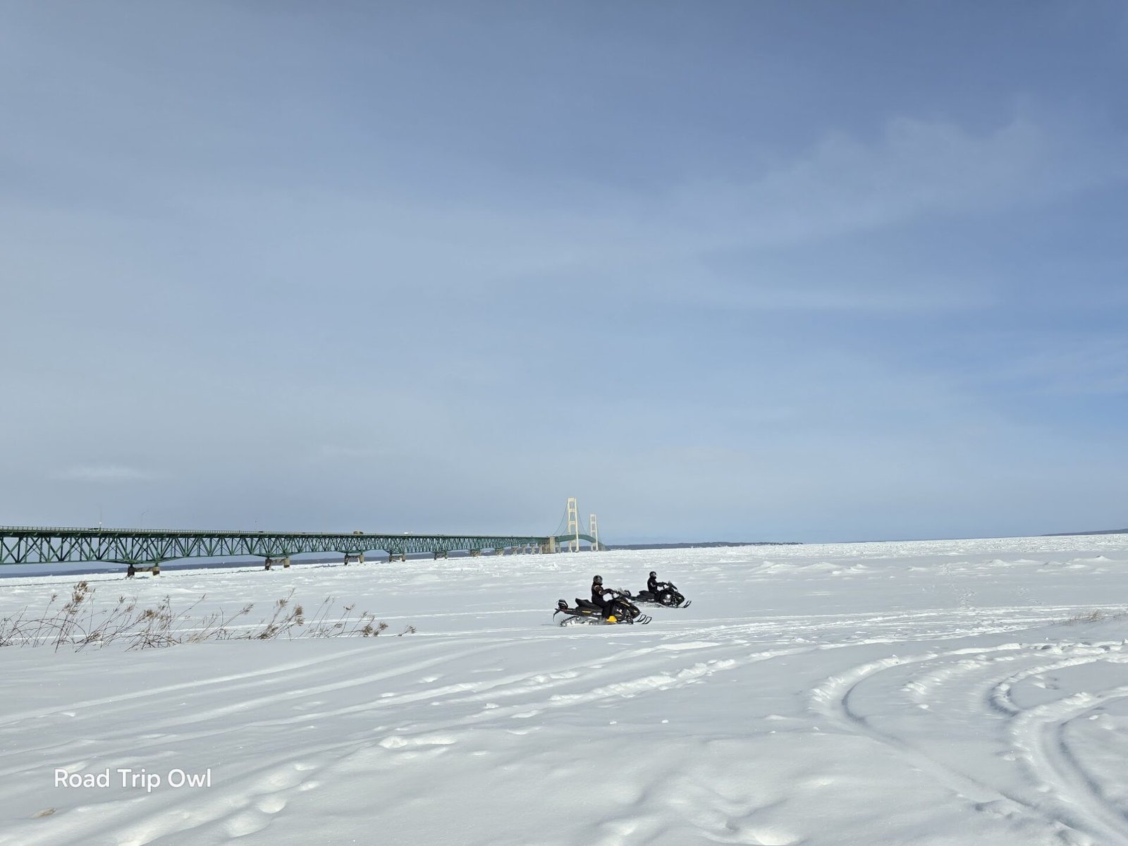 snowmobiling by the mackinaw bridge