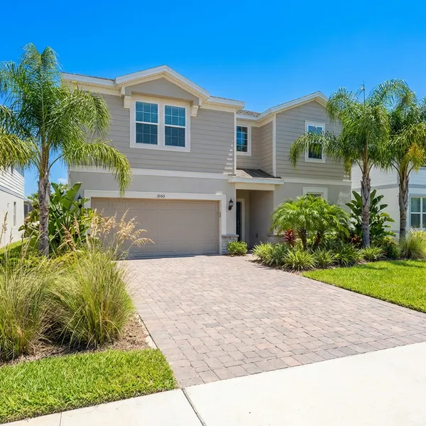 Nice vacation rental home exterior with no bikes, kayaks, or equipment visible in listing photo