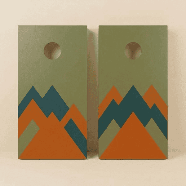 Homemade DIY cornhole set with custom painted boards and bean bags on a backyard lawn