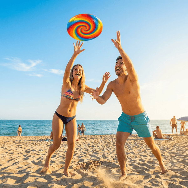 Colorful frisbees being tossed on a sunny beach perfect for camping and road trips