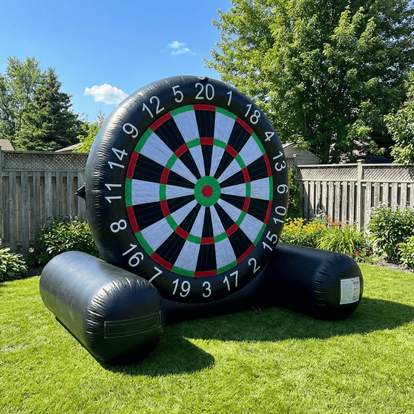 Giant 10 foot inflatable soccer dartboard set up on a sunny backyard lawn
