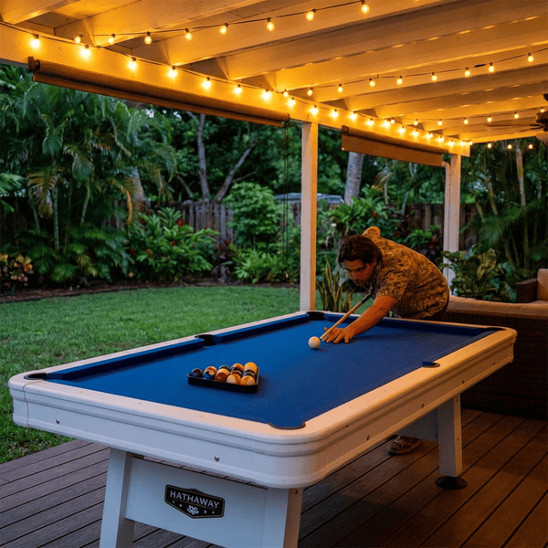 Weatherproof outdoor pool table on a covered patio at a vacation rental property