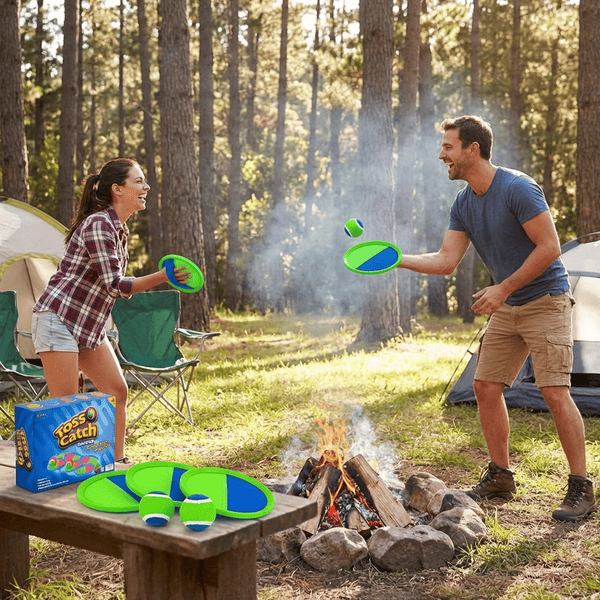 Portable red and blue metal horseshoe set with stakes ready to play at a campsite