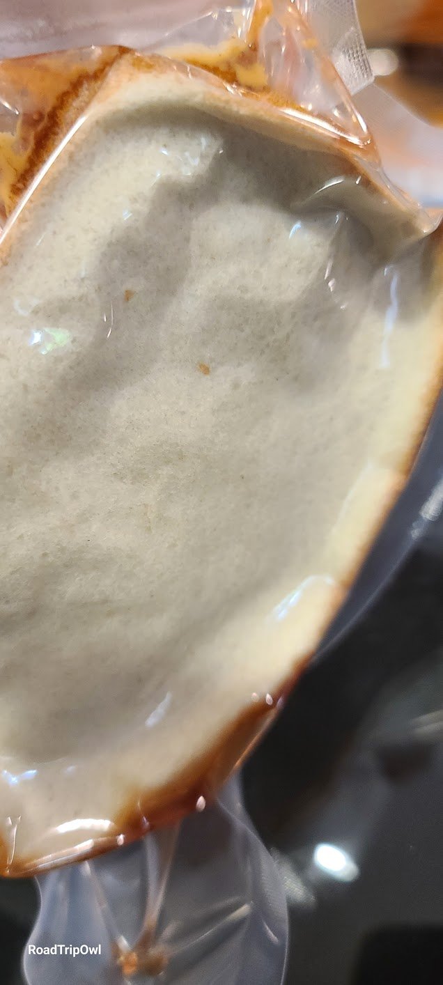 Vacuum sealed peanut butter sandwich severely flattened in chamber sealer bag