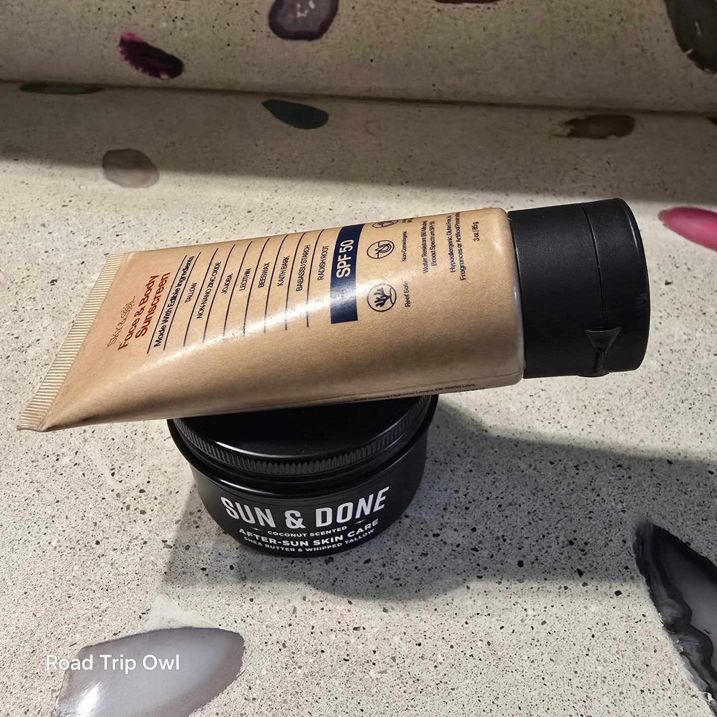 Sky and Sol clean sunscreen ingredient list close-up resting on Pilotfish Sun & Done jar