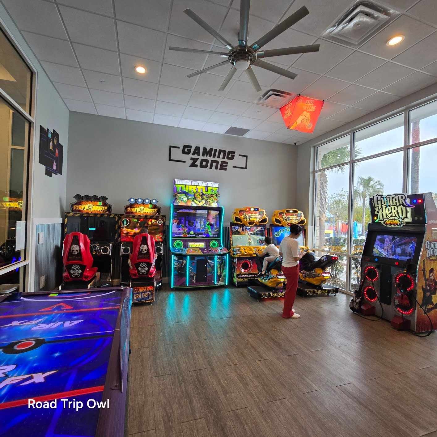 A child playing arcade games at the Gaming Zone at Windsor Island Resort — one of the free indoor amenities included with your Davenport, Florida vacation rental.