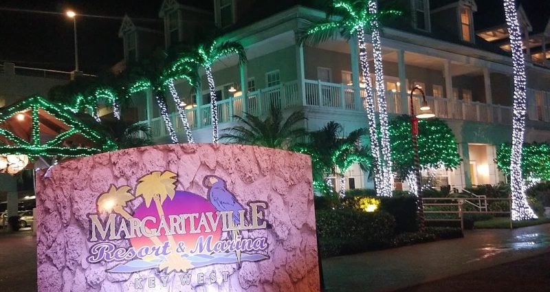 Margaritaville Resort Key West with palm trees wrapped in Christmas lights at night during Florida vacation